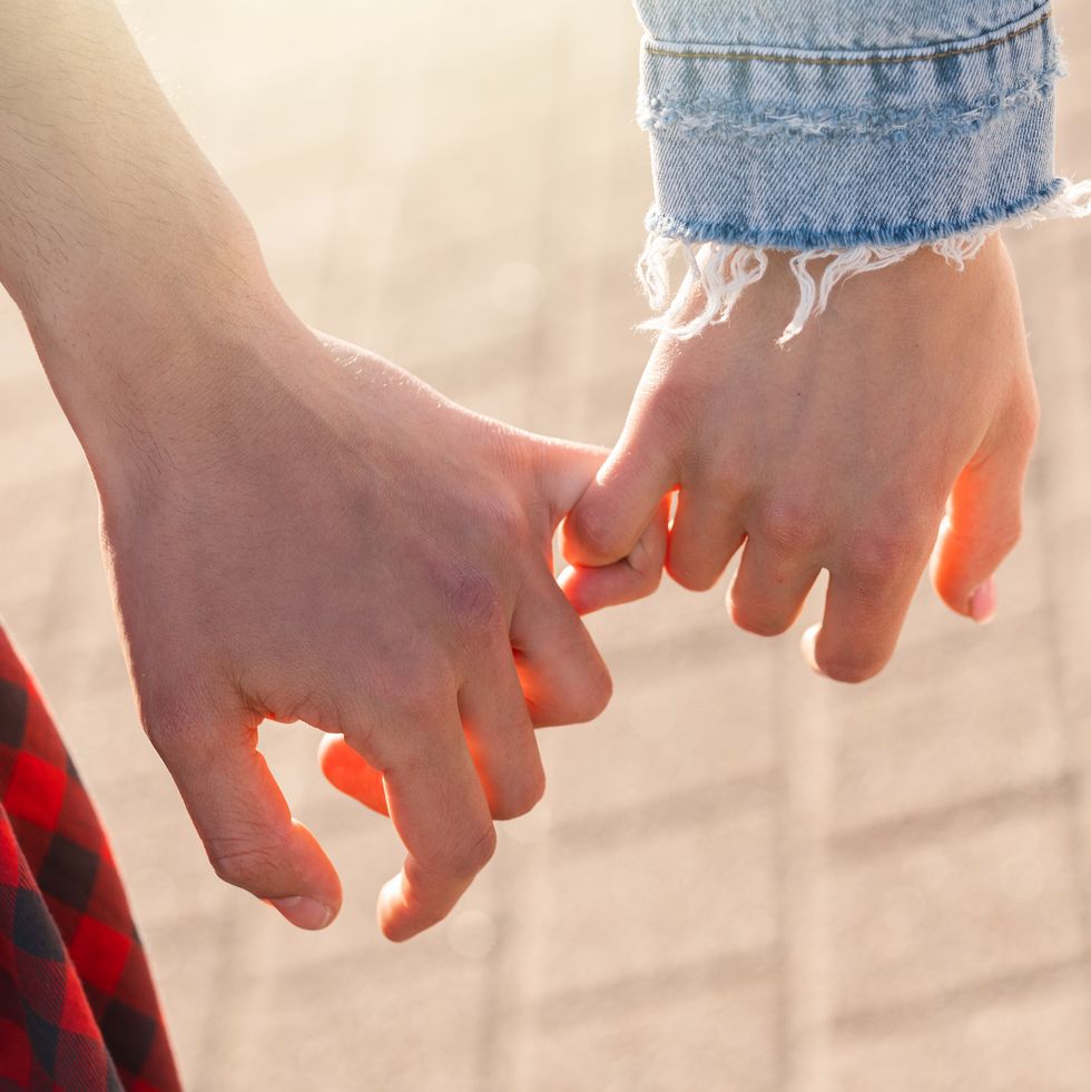 couple-holding-hands-with-a-pinky-grip-royalty-free-image-1692048016.jpg